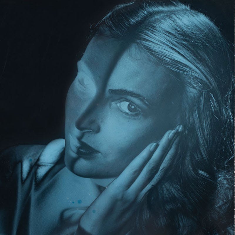 Vogue Cover Featuring A Woman's Face by Erwin Blumenfeld