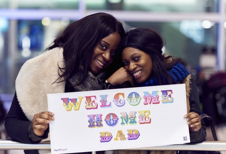 Street Artist Ben Eine customises welcome home banners for Christmas reunions