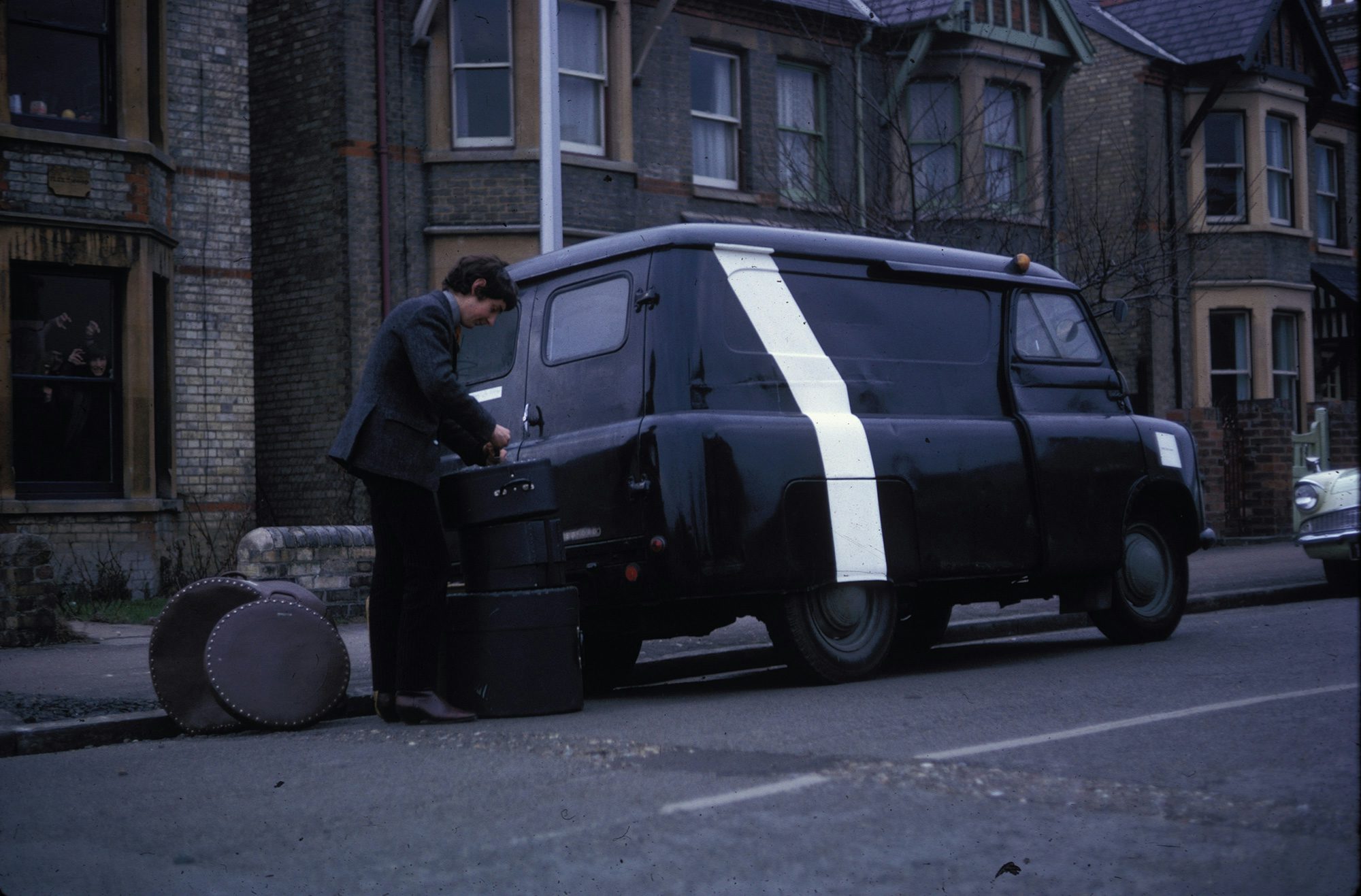 Nick Mason loading his drum kit into the Bedford van in 1965 on Rock Road, Cambridge. Image: Pink Floyd Archive