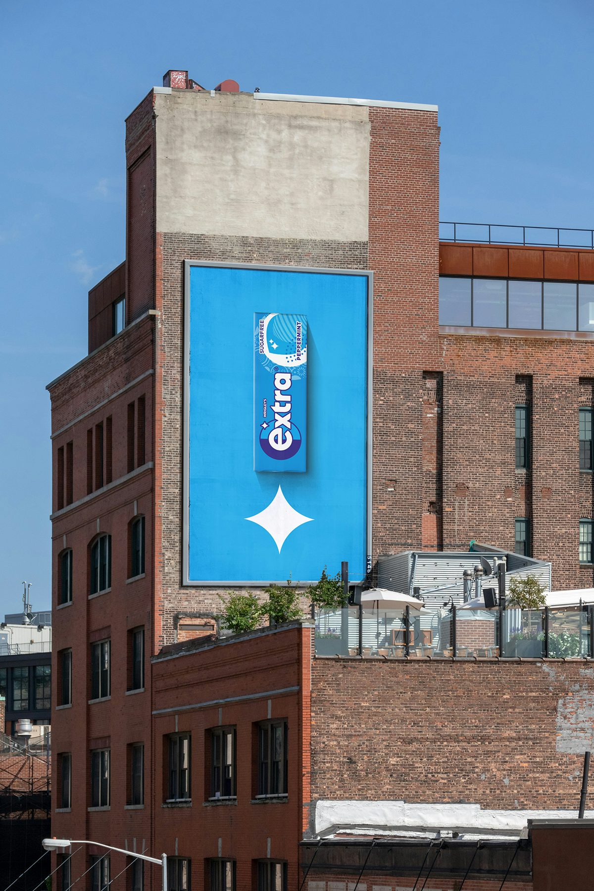 Photograph of a poster showing the new brand identity of Extra gum