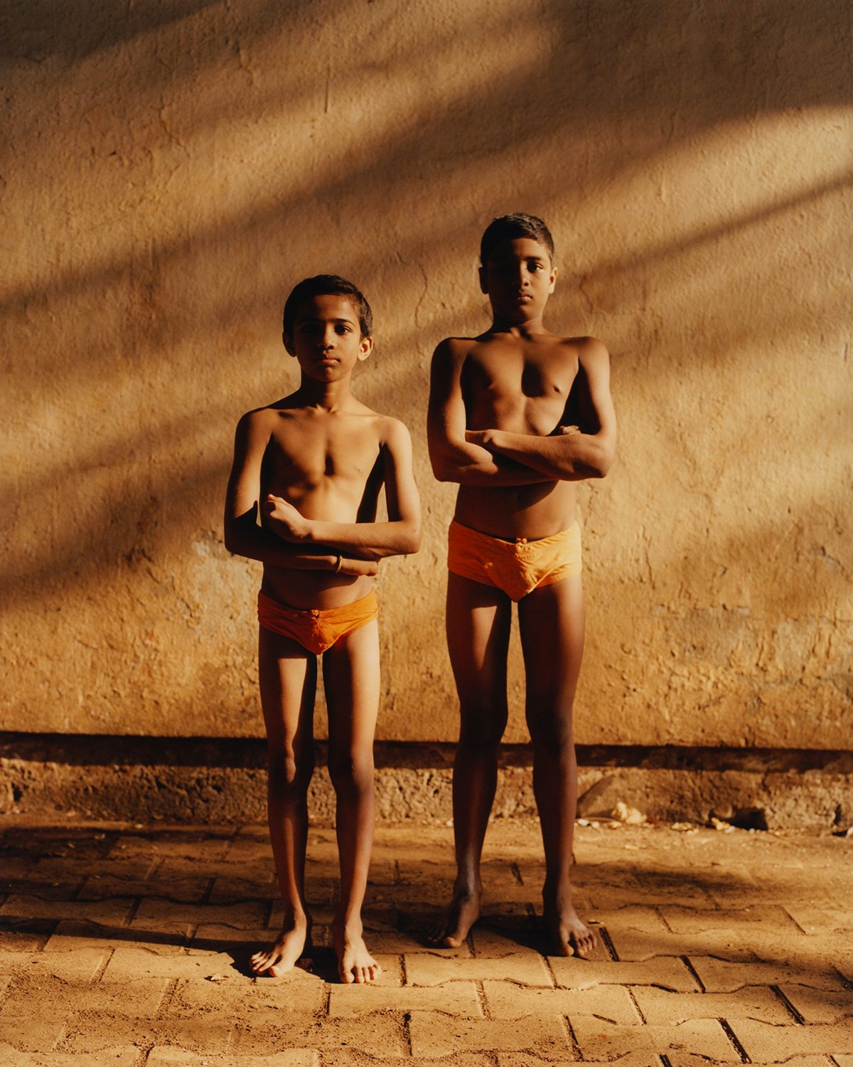 Photograph of two young people who practise Mallakhamb in Vivek Vadoliya's book