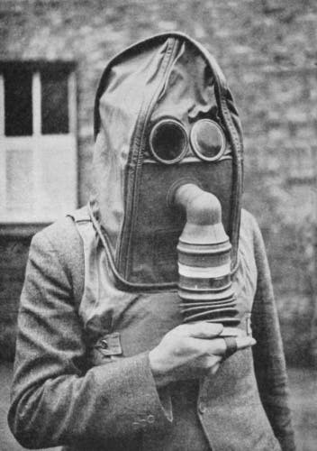 Civil Defence Manual of Basic Training: Basic Chemical Warfare (1949) Helmet respirator, showing the wearer operating the bellows