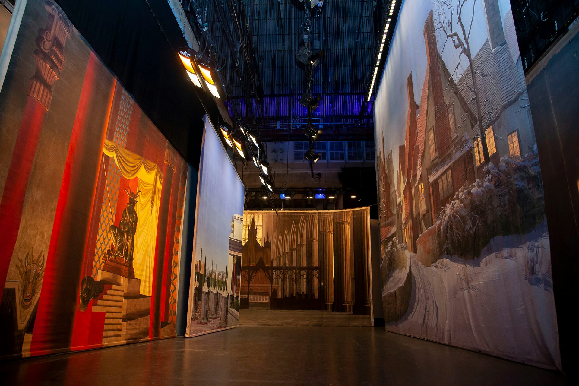 Photograph of the exhibition space featuring large backdrops