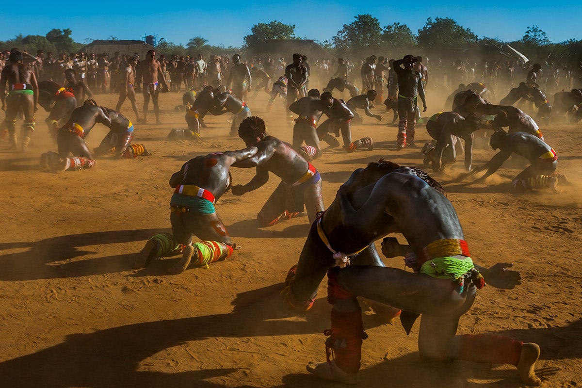 Photograph of Xingu peoples engaging in Huka huka during a ritual called Kuarup