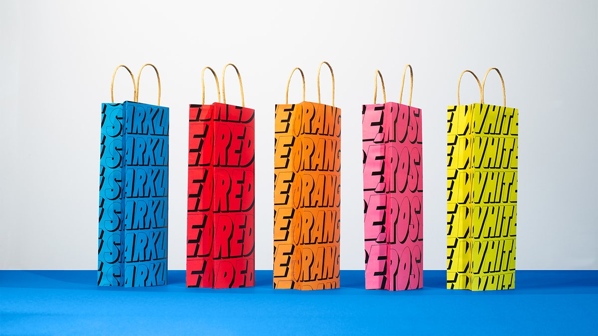 Photograph of Stompy branded paper bags designed by &Walsh