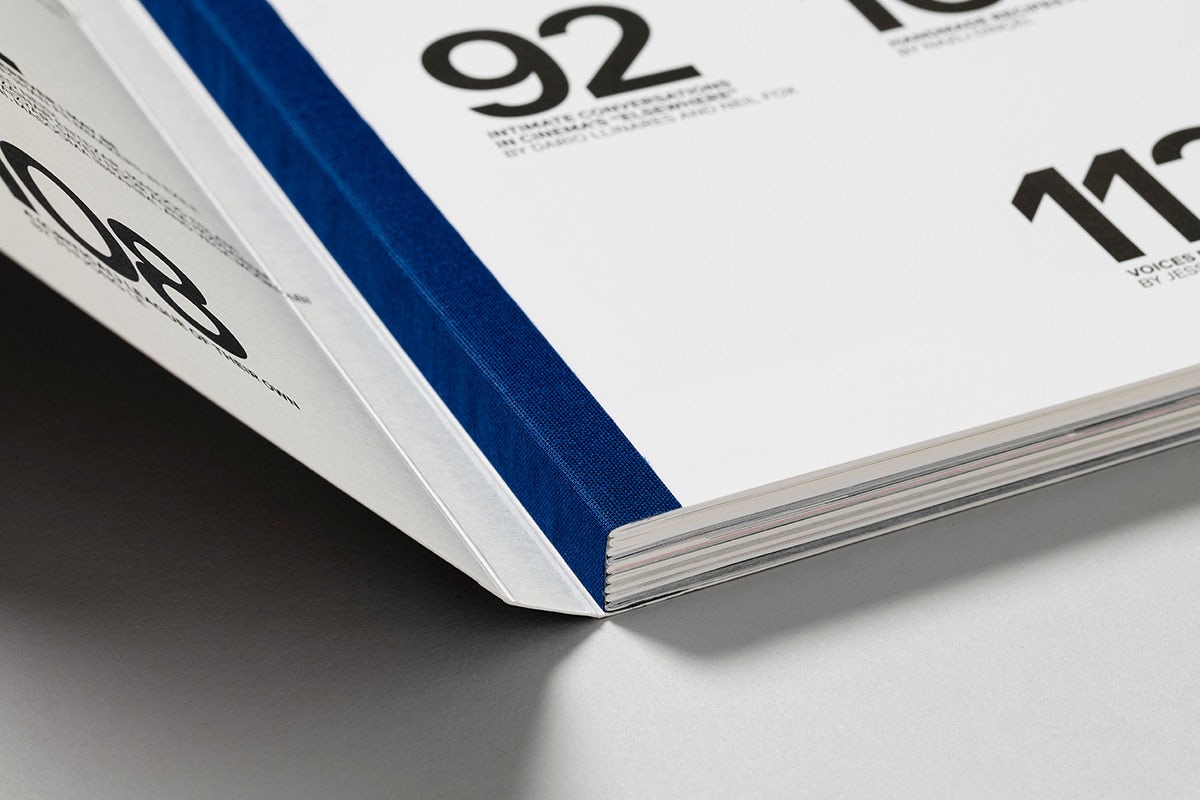 Close-up photograph of the blue spine of Mubi's Notebook magazine