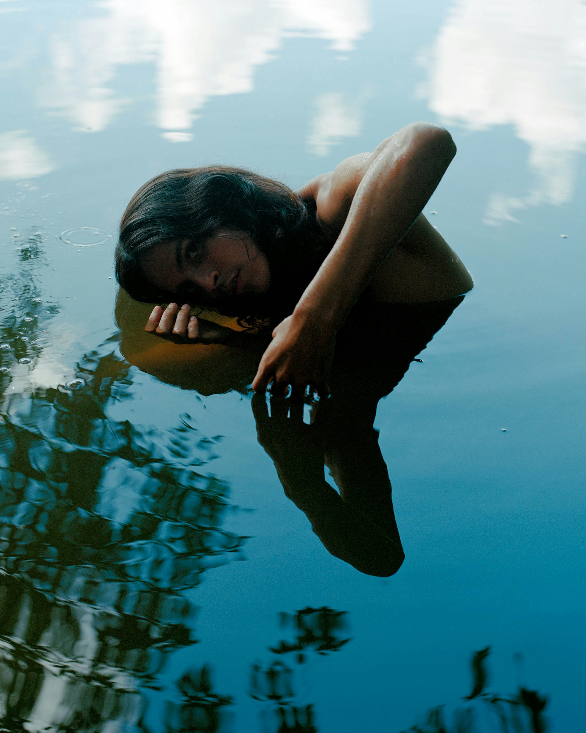 Photograph of a person whose body is submerged in water in Like a River by Daniel Jack Lyons