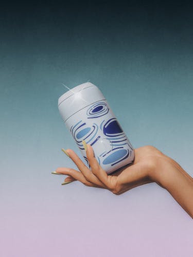 Photograph of a hand holding a blue water bottle by Chilly's and House of Sunny