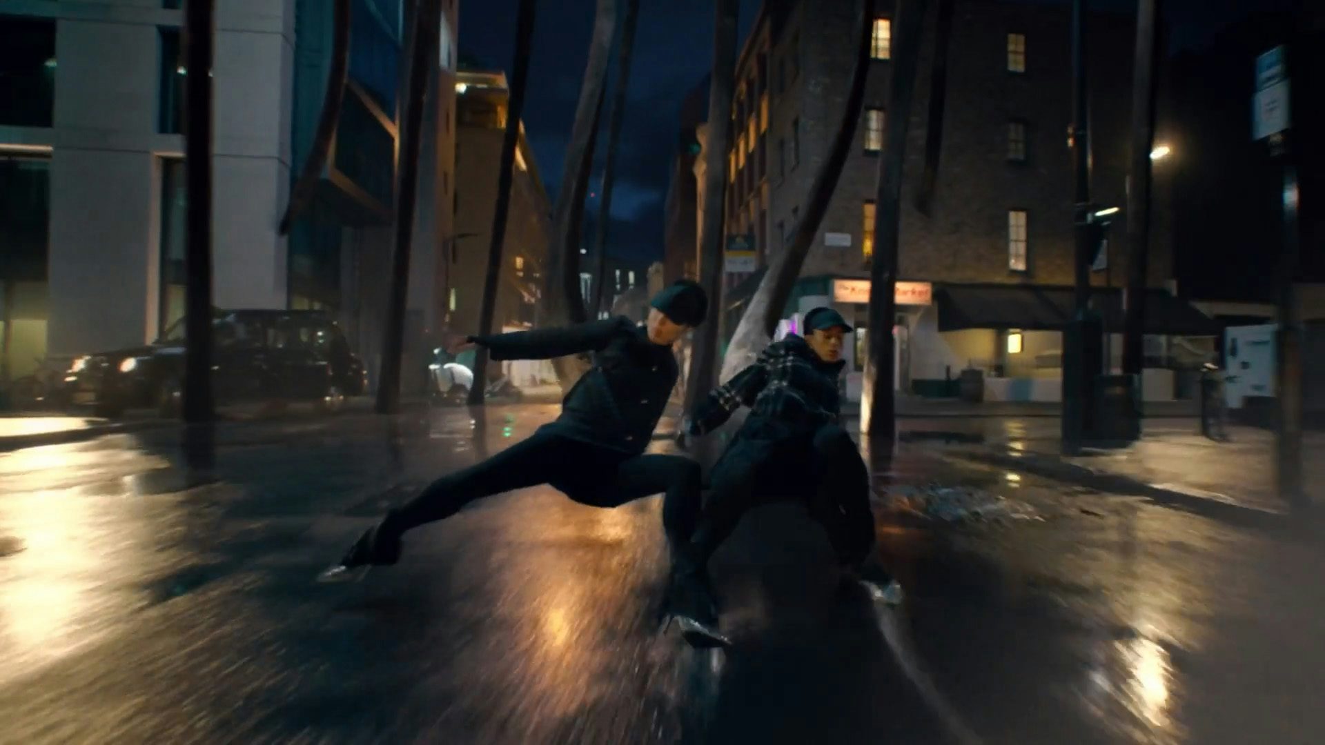 Still image of two dancers being dragged by a creature in the streets from the Burberry Night Creatures campaign film by Megaforce