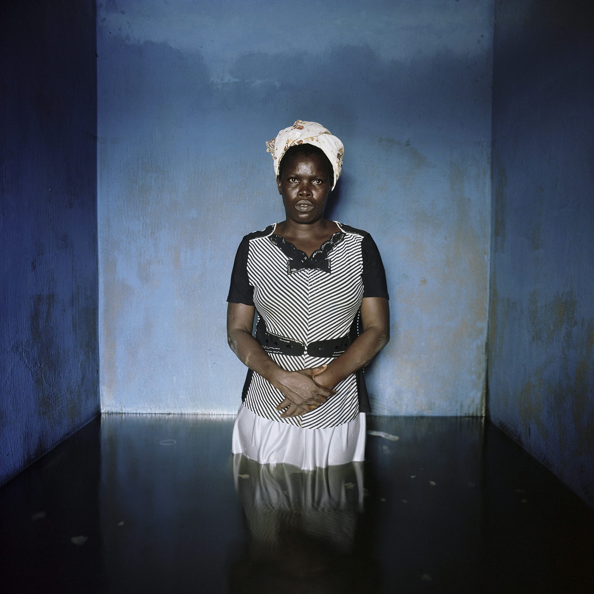 Florence Abraham, Igbogene, Bayelsa State, Nigeria, November 2012. From the series Drowning World © Gideon Mendel