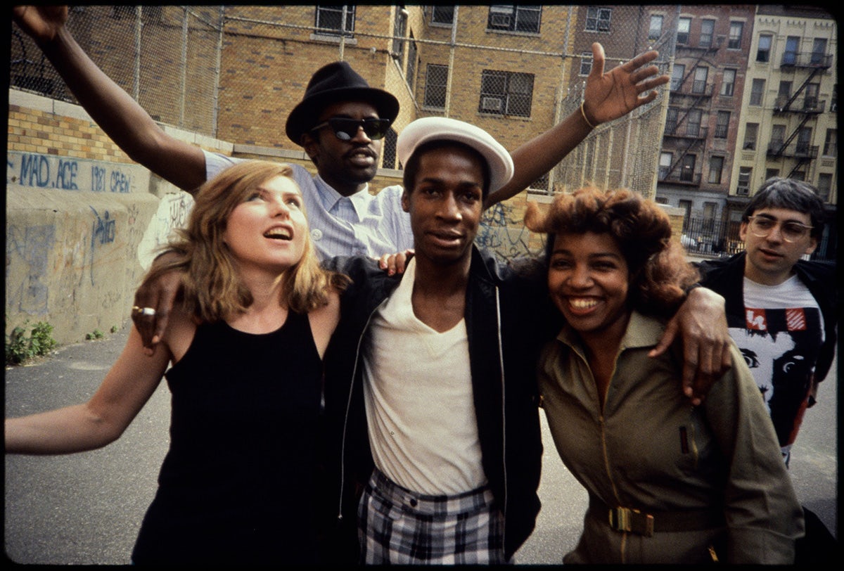 Photograph of Debbie Harry and Chris Stein from Blondie, Grandmaster Flash, Fab 5 Freddy, and a friend