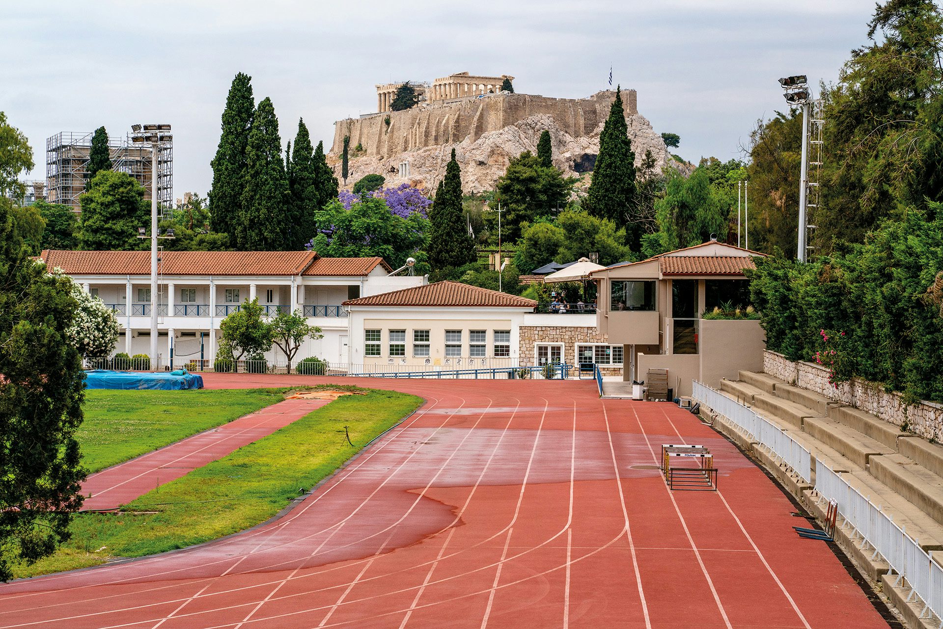 Image by Niko J. Kallianiotis shows a running track overlooked by the Acropolis in Athens