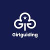 Graphic shows the new Girlguiding branding featuring a white tree emblem on a dark blue background