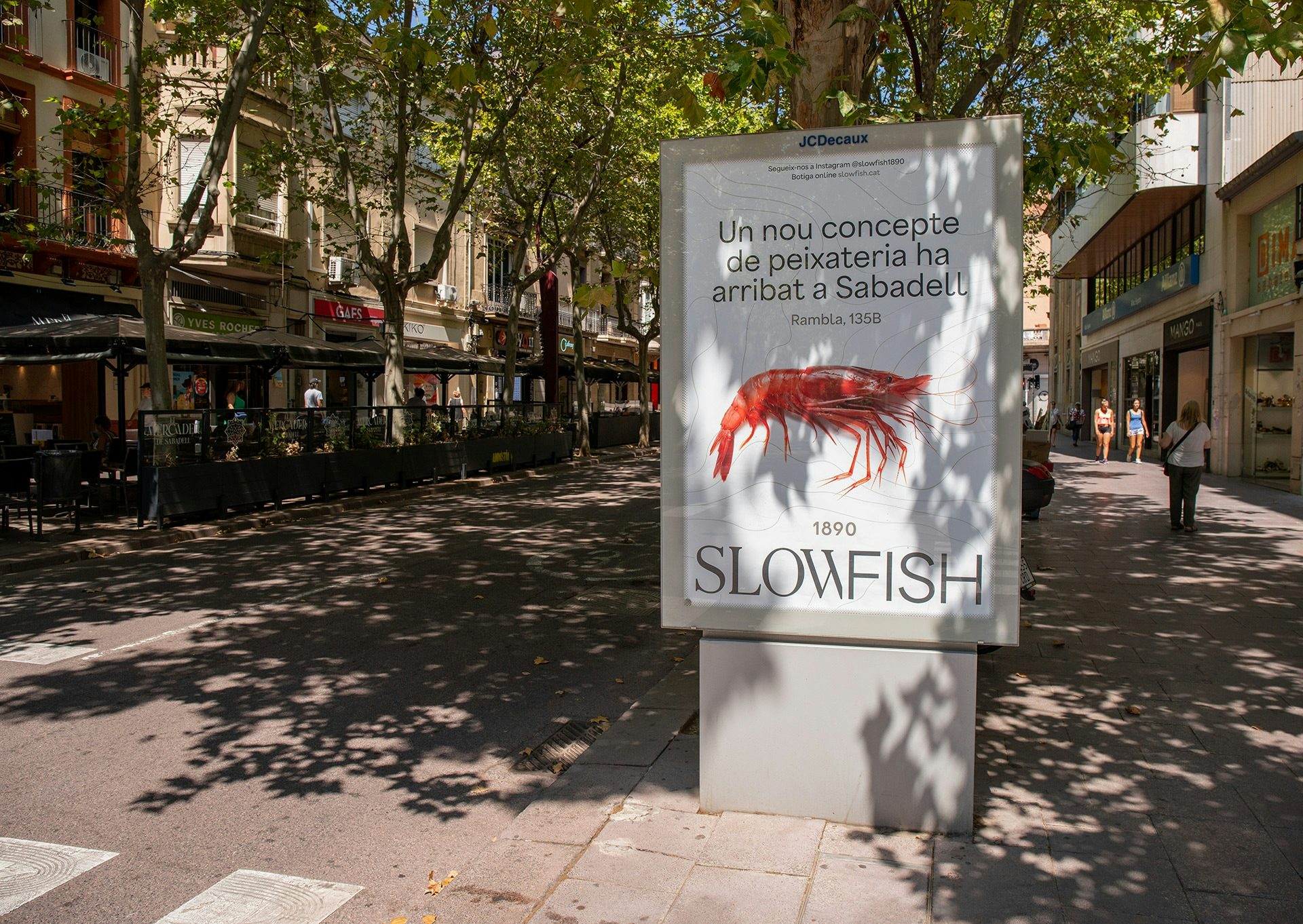 Photograph of a sign featuring the Slowfish branding by Vasava, featuring an illustration of a shrimp