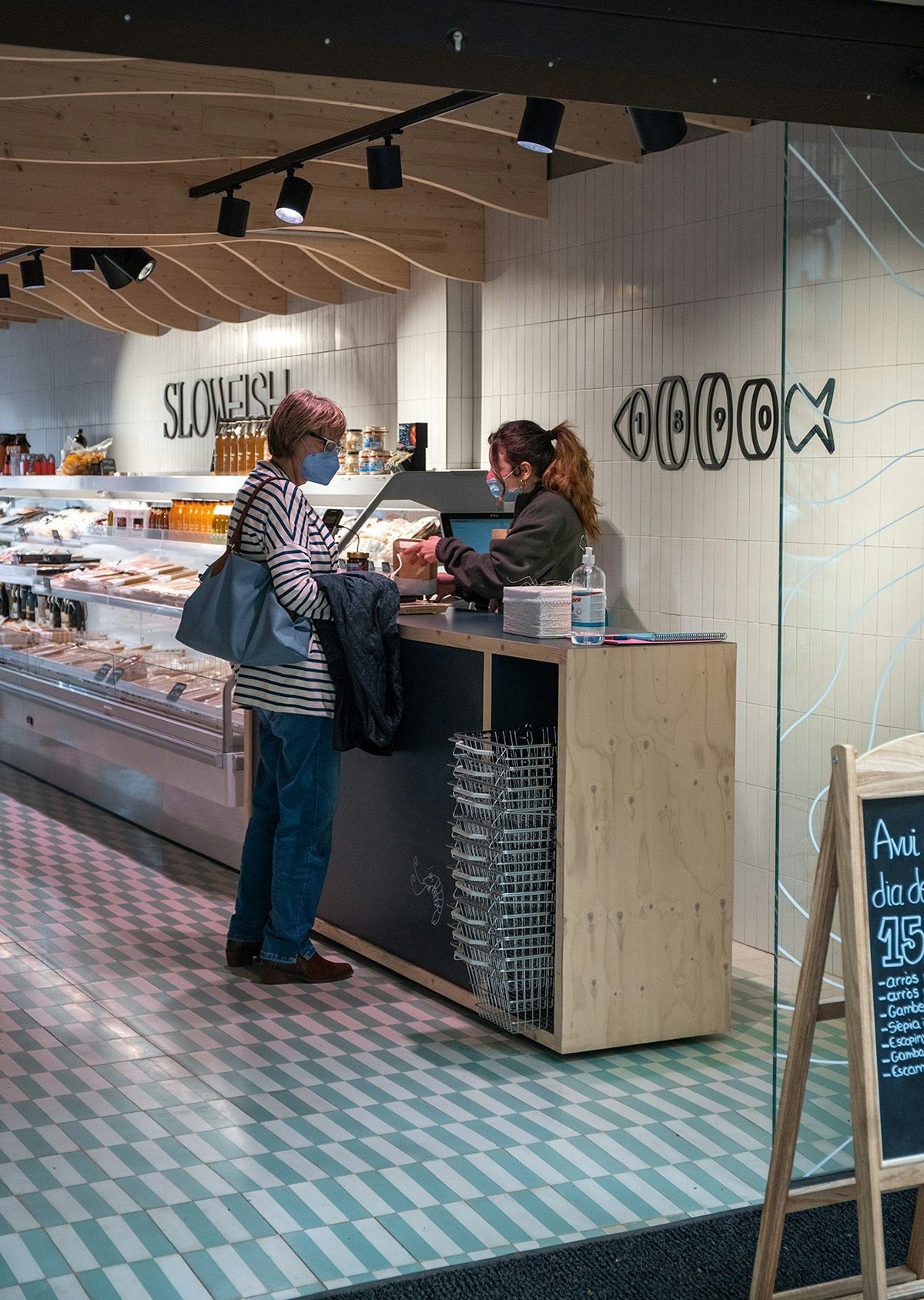 Photograph of a shop counter with signage for Slowfish by Vasava