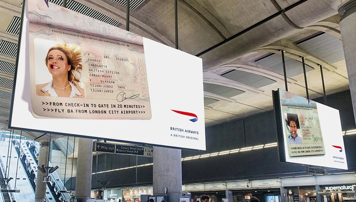 Image shows a British Airways advert of inside a station showing an edited passport page, featuring a passport photo of a person with their mouth blown wide open