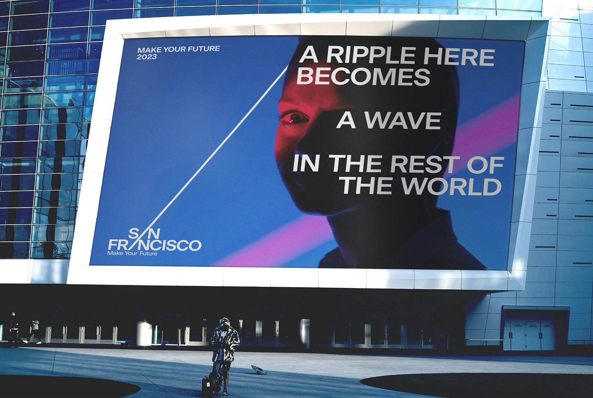 Image of the San Francisco place branding shown on a large outdoor advertisement that reads 'A ripple here becomes a wave in the rest of the world' laid out over a photo of a person's face