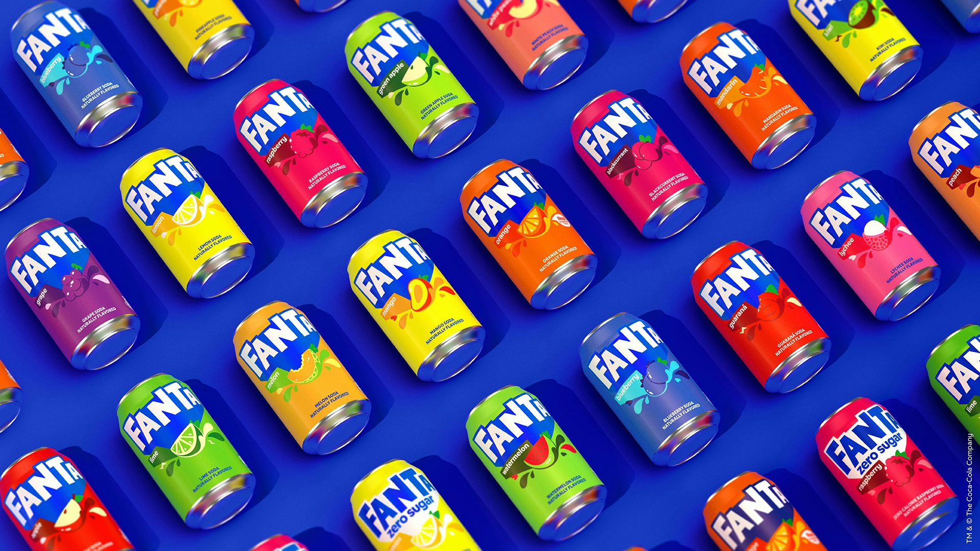 Image shows a range of Fanta drinks cans lined up on a bright blue background