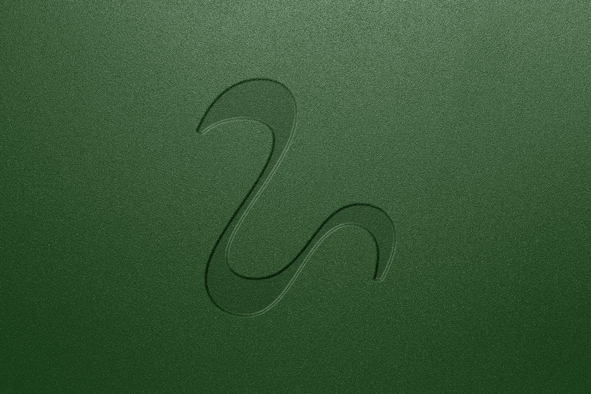 Image showing the logo for Leath, the shape of a 'U' tilted to the right, shown on a dark green background