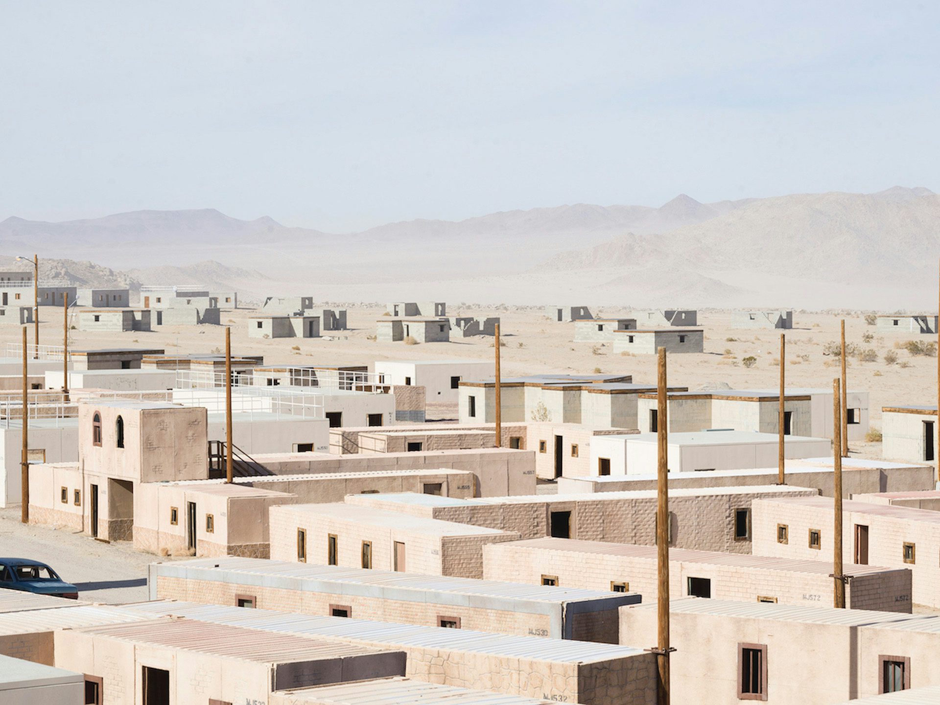 Image from American Glitch by Andrea Orejarena and Caleb Stein showing a replica Iraqi village surrounded by desert