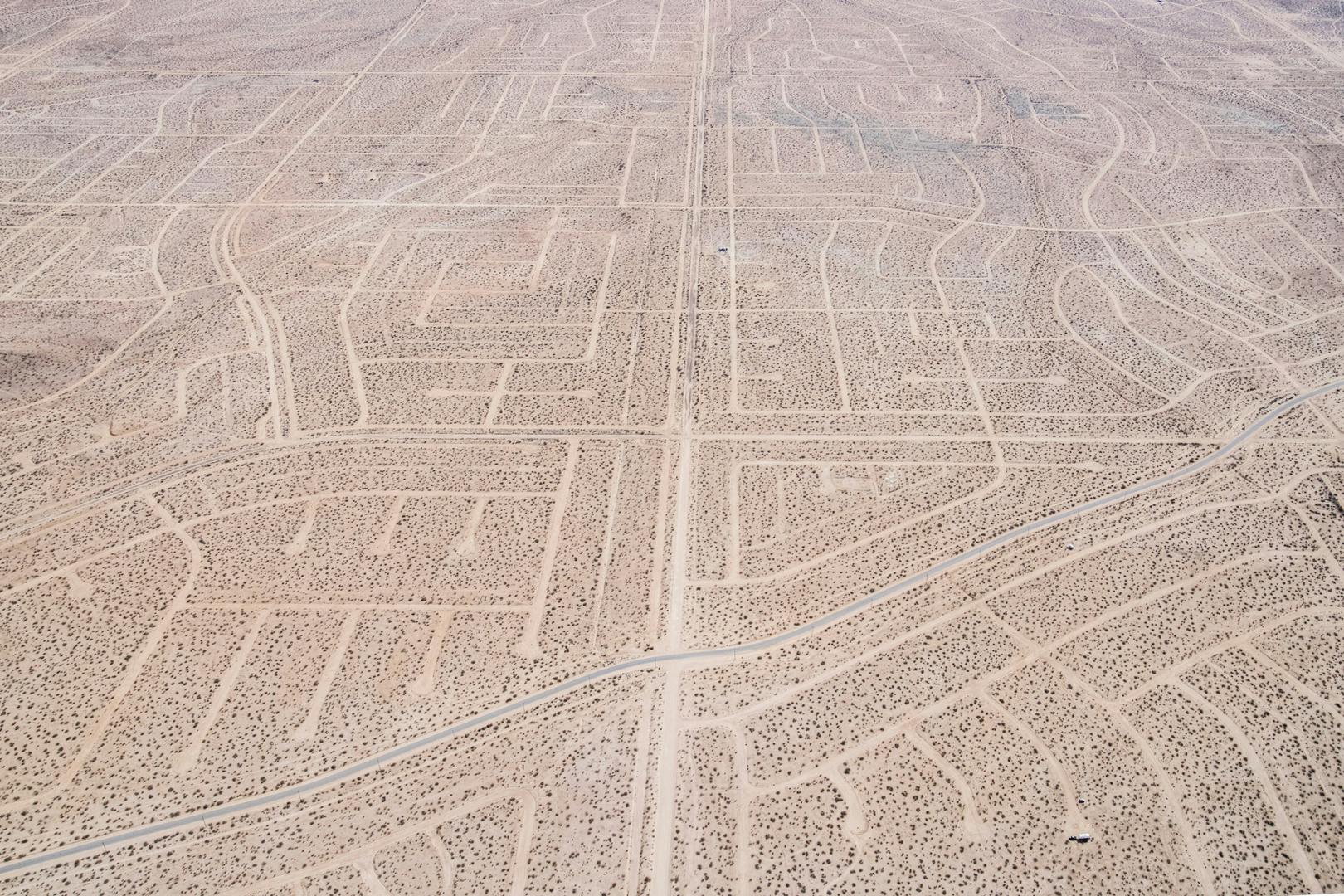 Aerial photo from American Glitch by Andrea Orejarena and Caleb Stein showing a network of roads in the Californian desert