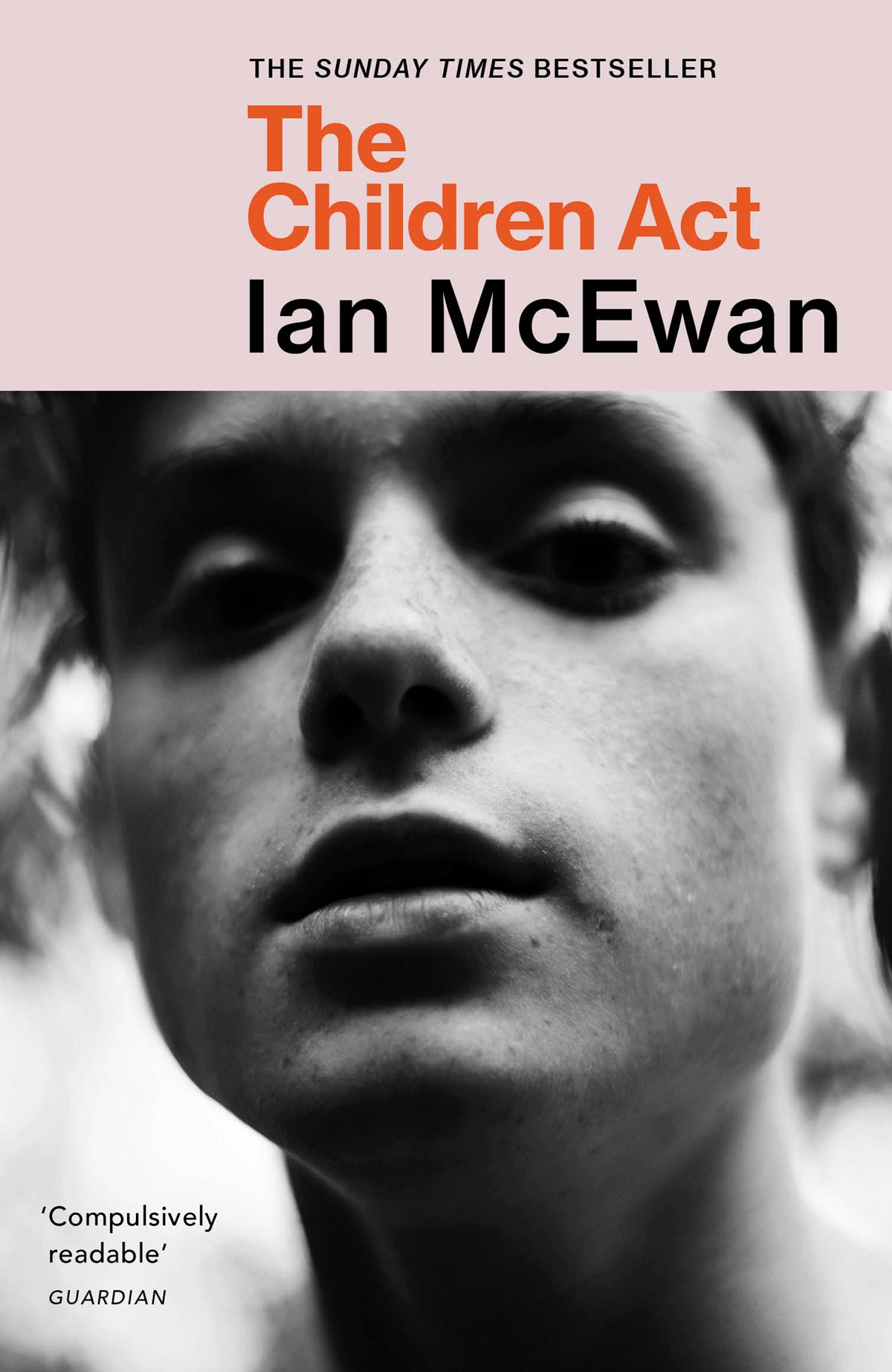 Cover of The Children Act by Ian McEwan showing a black and white close up portrait of a person's face gazing down at the camera
