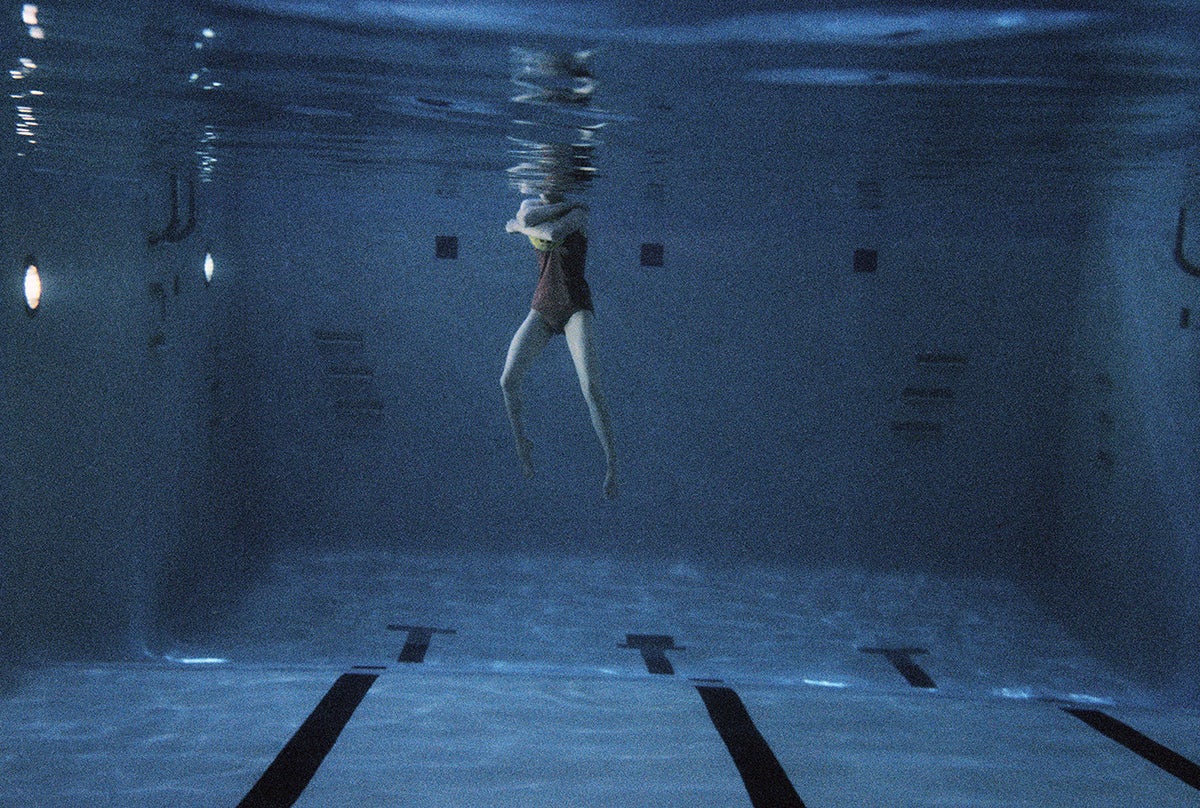 Photograph by Larry Sultan from his series Swimmers showing a person's body in a swimming pool