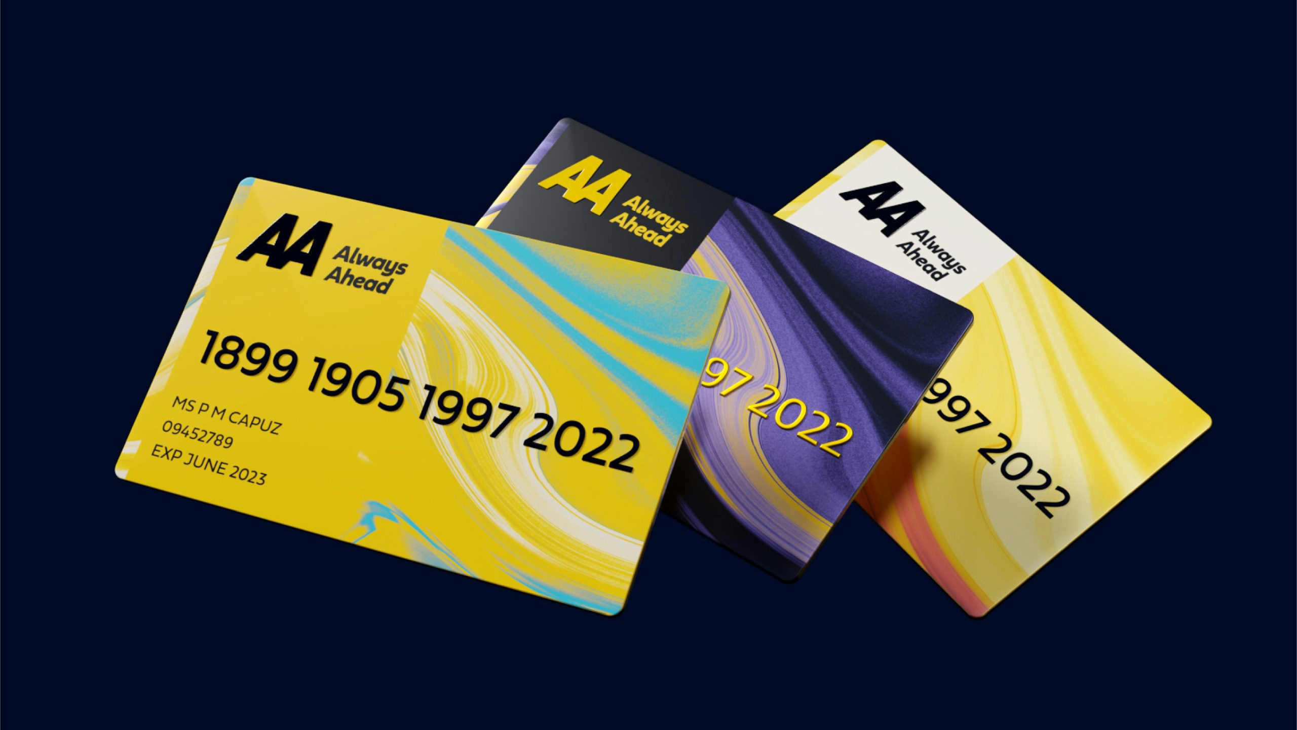 Image shows three membership cards for the AA, two with a swirling pattern on a yellow background, another showing a purple and yellow swirling background