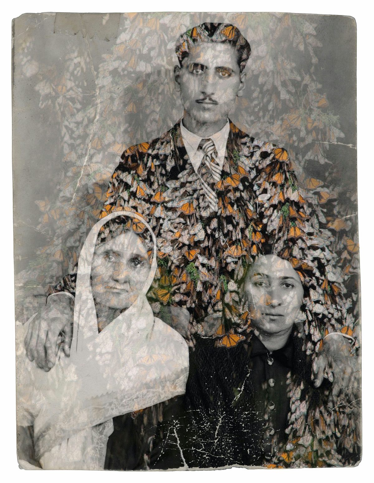 Image by Nazli Abbaspour using an old family photo of two women, one wearing a veil, in the foreground and the man in the background with a hand on each woman's shoulder, covered with an orange floral translucent layer over the photograph