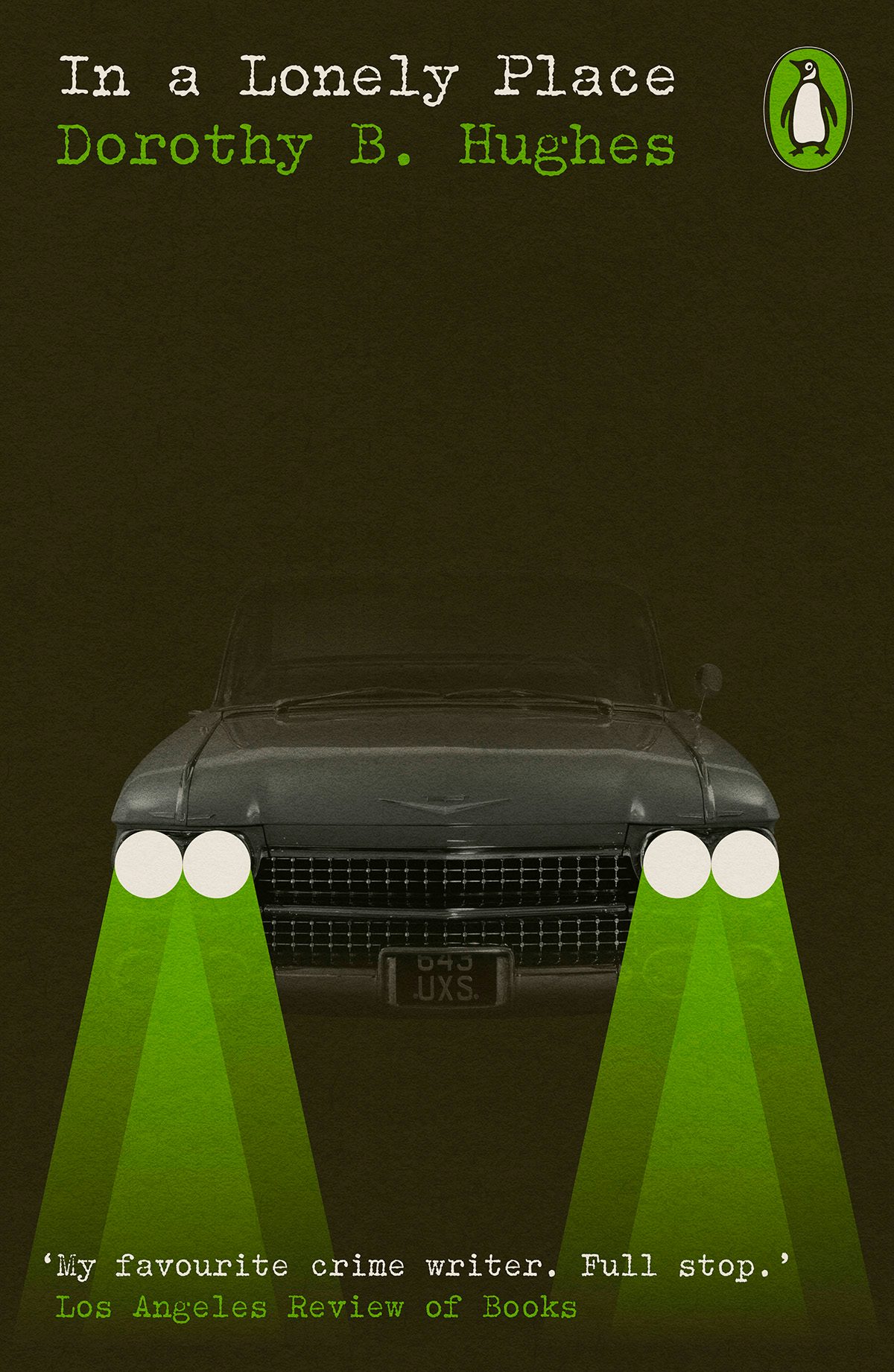 Image shows the cover of In a Lonely Place from Penguin Modern Classics Crime and Espionage series, showing a muted illustration of a car bonnet covered in shadows except for triangular green beams from the car headlights