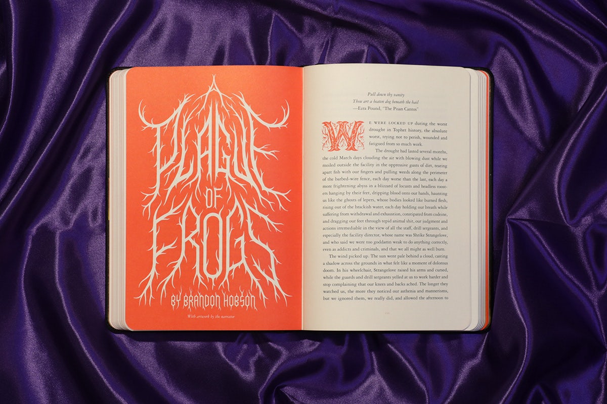 Photograph showing a spread inside McSweeney's Issue 71 Horror featuring a peach page on the left with the title 'A plague of frogs' in horror style font, and text on the right hand page