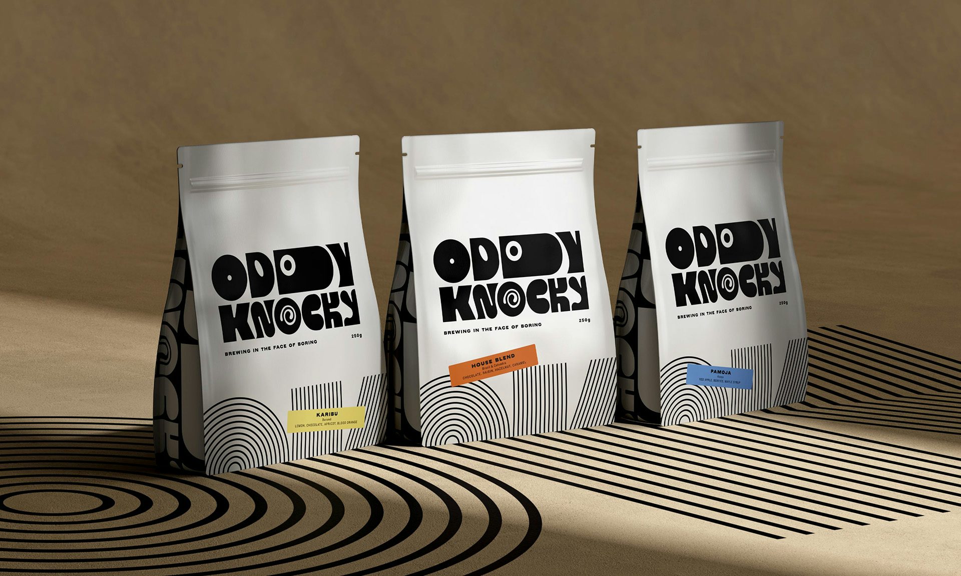 Photo showing the branding for Oddy Knocky on three product packages decorated with the brand's quirky elongated wordmark