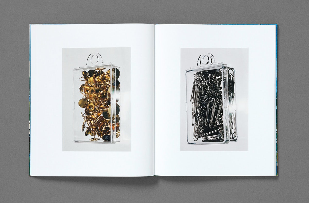 Image showing a spread from Dream About Nothing by Bobby Doherty featuring two photos of stationery encased in plastic transparent containers