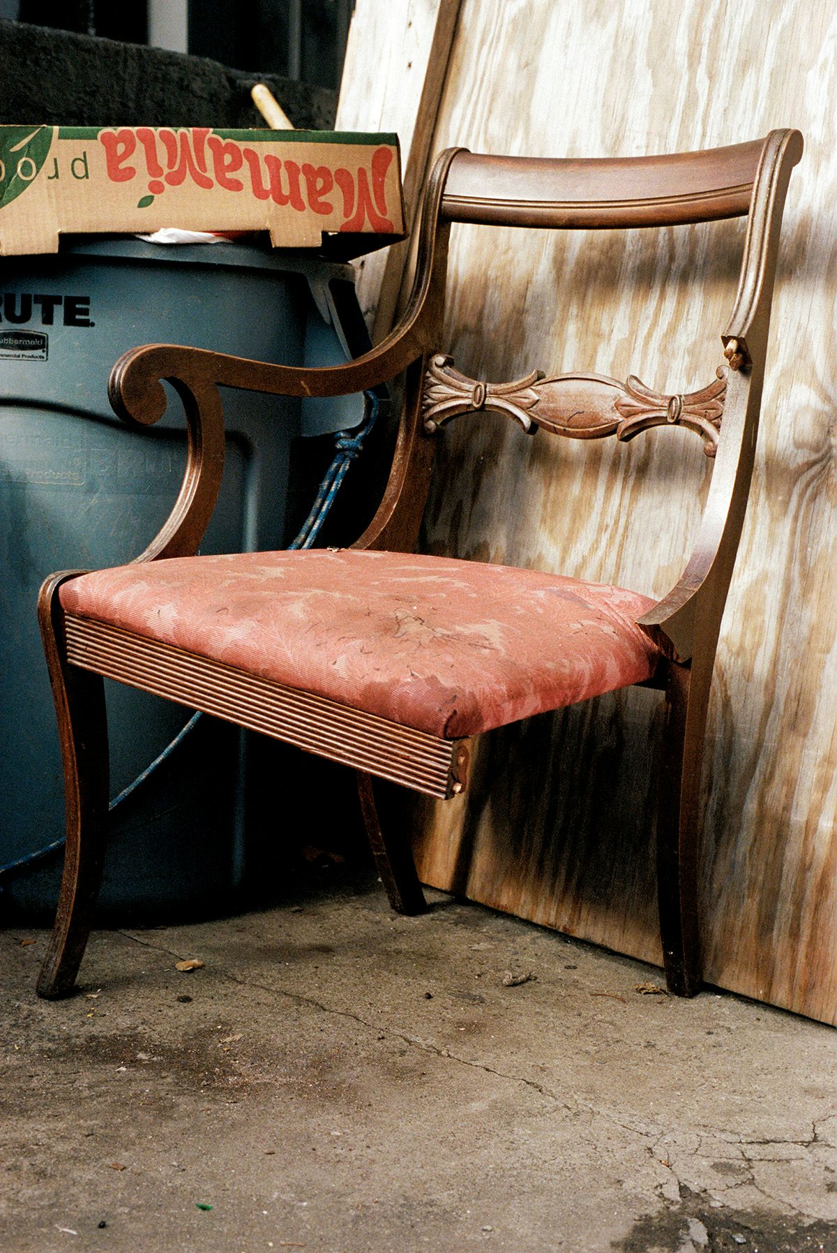 Image from Dream About Nothing by Bobby Doherty showing a wooden chair with one leg missing