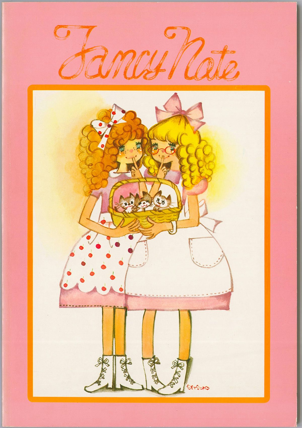 Image of a pink notebook with a cover illustration showing two girls in puffy dresses on show at the Somerset House exhibition Cute