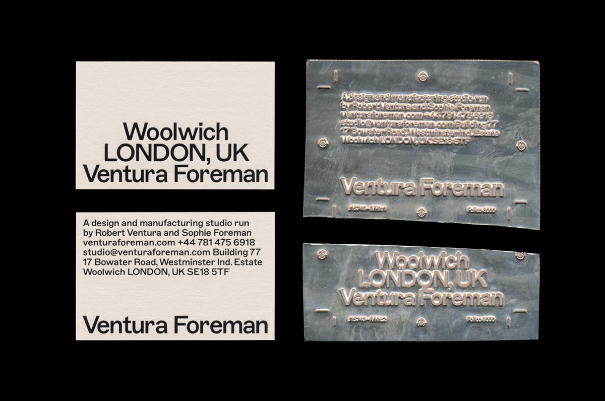 Photo showing Ventura Foreman's identity by Studio Blackburn on a business card and a metal plate that's been split in two