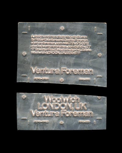 Photo showing Ventura Foreman's identity by Studio Blackburn on a metal plate that's been split in two