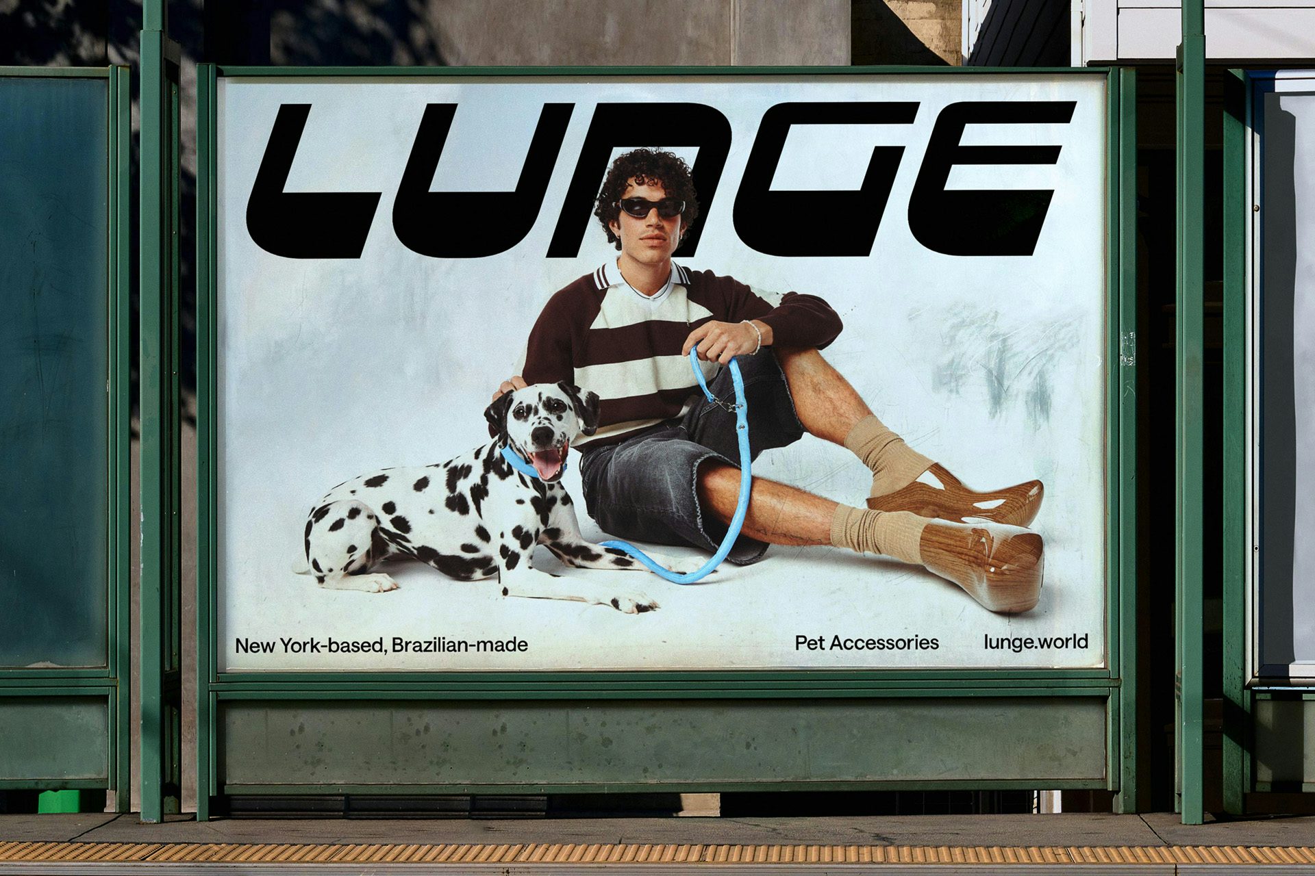 Image showing the identity for Lunge on an outdoor ad featuring a dalmatian and a person sat next to it holding a lead