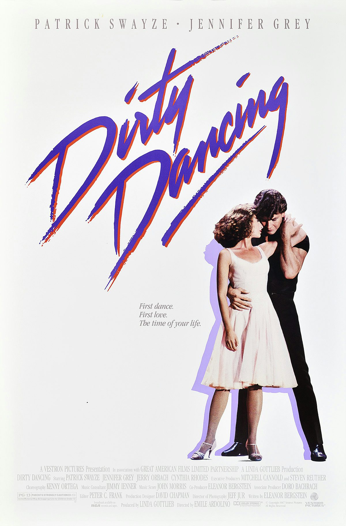 Image shows the poster design for Dirty Dancing featuring a cut-out photograph of stars Patrick Swayze in a black outfit and Jennifer Grey in a white dress, with purple drop shadows against a white background. The movie title is written in purple and red cursive, and the poster features the copy 'First dance, first love, the time of your life'