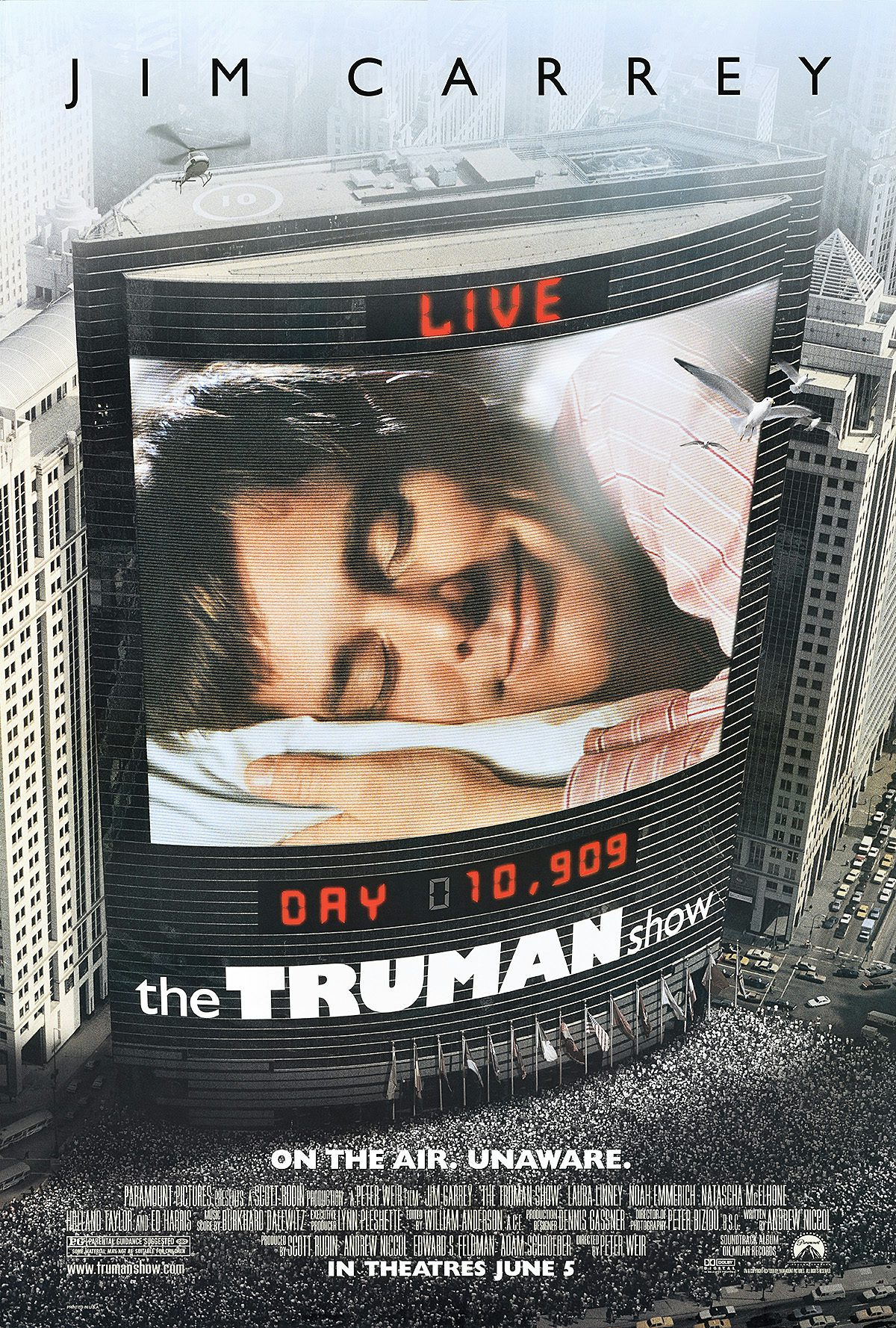 Poster design for The Truman Show, featuring a photo of star Jim Carrey asleep, which appears to be showing on a large public live billboard. The copy reads 'On the air, unaware'