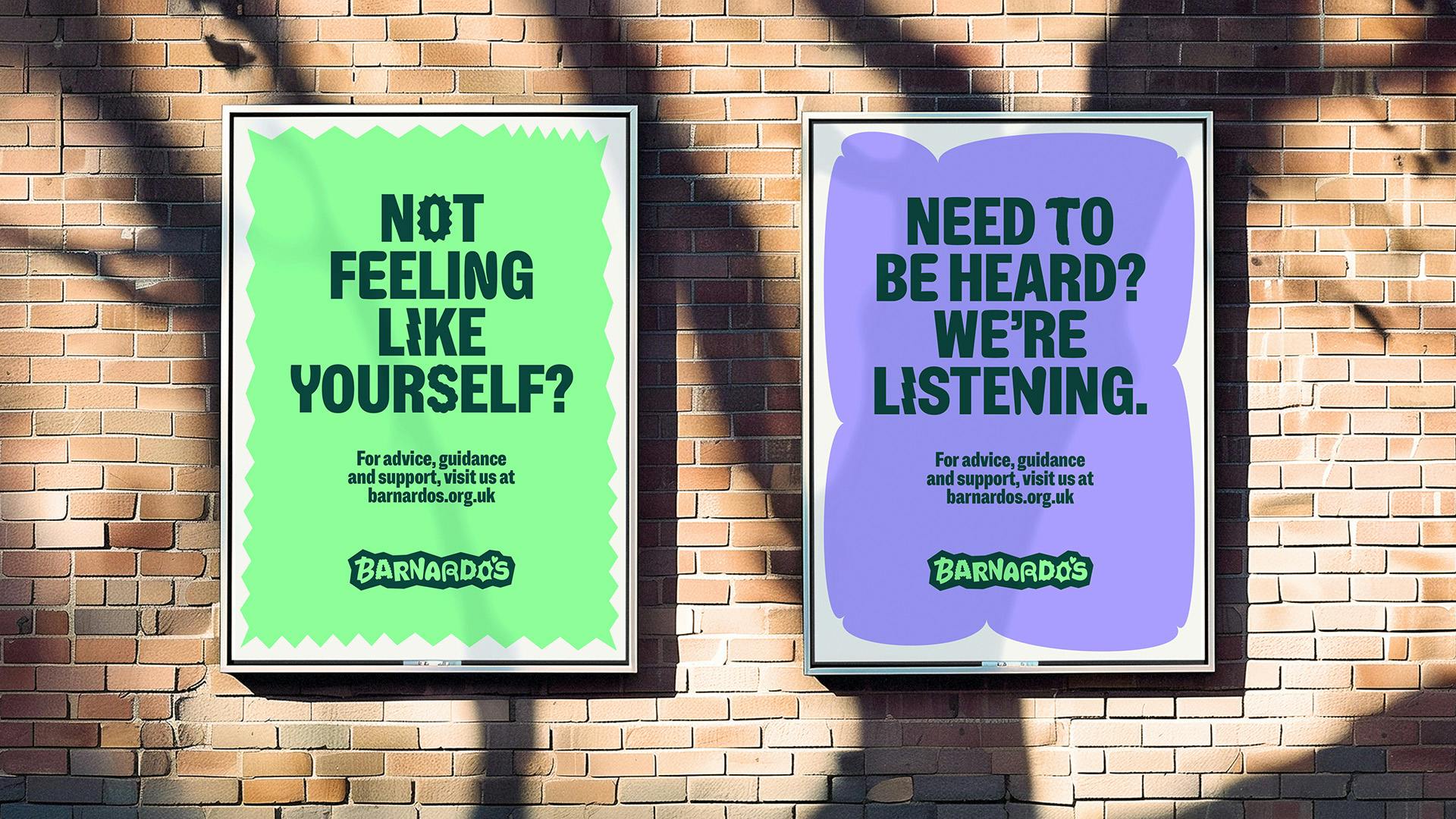 Image shows the new Barnardo's visual identity on two vertical outdoor posters. One reads 'not feeling like yourself?' on a green background, the other reads 'Need to be heard? We're listening' on a purple background