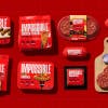 Image shows the Impossible product line up featuring its new red branding and packaging design