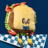 Plushie toy in the shape of a sandwich with a cartoonish smiling face