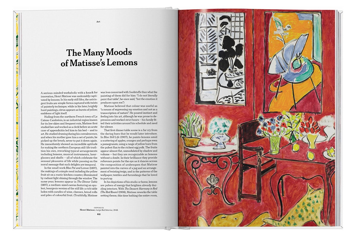 Photograph of a spread from The Gourmand's book, Lemon, showing a written text on the left hand page headlined 'The many moods of Matisse's lemons', and on the opposite page is a predominantly red-toned painting by Matisse showing a table and bench covered in vases of flowers with artworks on the wall in the background