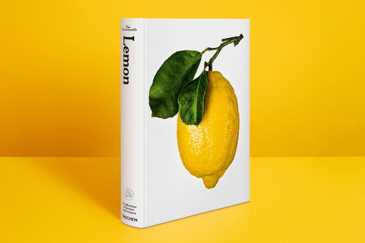 Photograph of The Gourmand's book, Lemon, featuring a white cover with a close up photograph of a lemon and its leaves