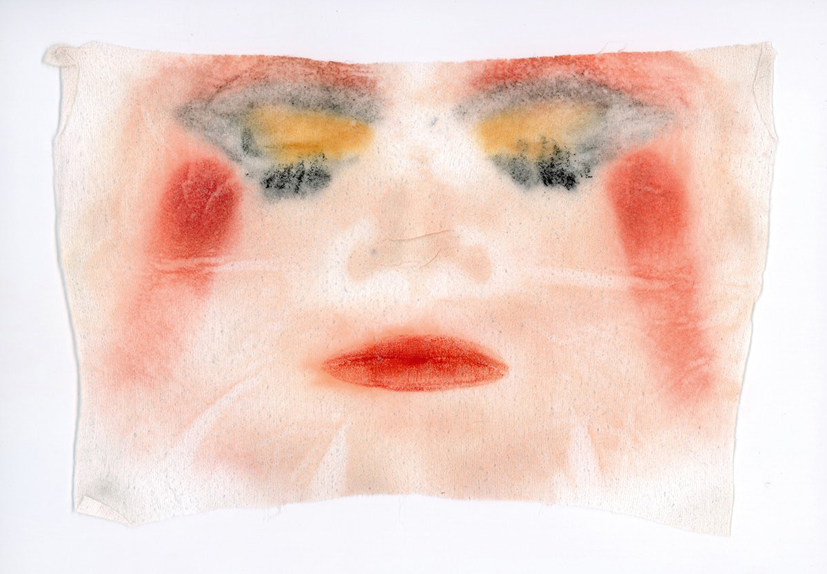 Spread from Women by Nadia Lee Cohen showing a face wipe with colourful make-up residue in the shape of a face