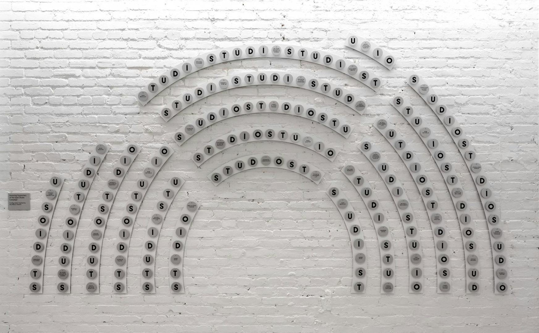 Wall installation in the shape of semi-circular rows of theatre seats