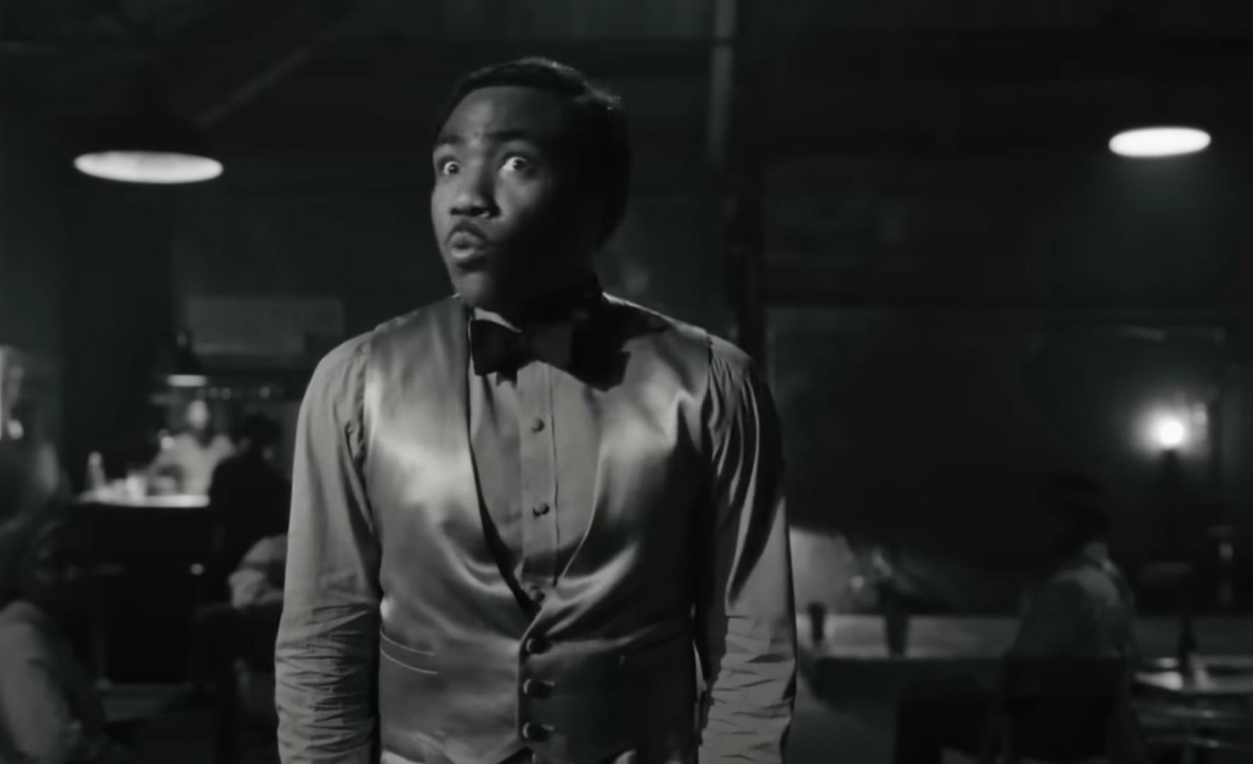 Black and white still of Childish Gambino in the jazz era from his music video Little Foot Big Foot