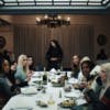 Still from the music video for 360 by Charli XCX, showing Charli standing at the end of a dining table with guests including Rachel Sennott and Julia Fox sat around it