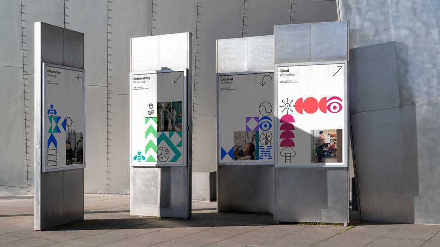 Graphic posters for IBM Techxchange attached to pillars